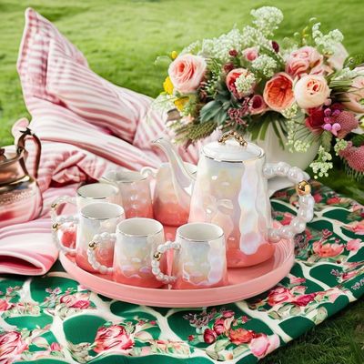 モダンな高級ピンクセラミックティーカップセット シェルデザインと 午後お茶の皿